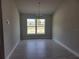 Bright dining room with tile flooring and a view from a large window at 36158 Welsh Glade Rd, Dade City, FL 33525