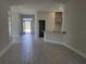 Spacious entryway with tile floors and views to the living and dining areas at 36158 Welsh Glade Rd, Dade City, FL 33525