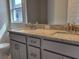Bathroom featuring a double vanity with granite countertop at 36158 Welsh Glade Rd, Dade City, FL 33525