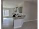 Modern kitchen with gray cabinets, granite countertops, and stainless steel appliances at 36158 Welsh Glade Rd, Dade City, FL 33525