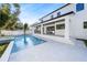 Beautiful backyard with a pool, spa, covered patio, and a modern home exterior, ideal for entertaining at 2106 S Cortez Ave, Tampa, FL 33629
