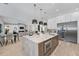 Open-concept kitchen featuring a large island, stainless steel appliances, and access to the living area at 2106 S Cortez Ave, Tampa, FL 33629