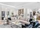 Spacious living room featuring an open concept to the kitchen, stylish furniture, and modern decor at 2106 S Cortez Ave, Tampa, FL 33629