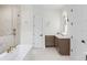 Luxury bathroom with double vanity, free-standing tub, walk-in shower and elegant finishes at 2106 S Cortez Ave, Tampa, FL 33629