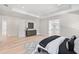 Light-filled main bedroom features tray ceilings, a light hardwood floor, and an en-suite bathroom at 2106 S Cortez Ave, Tampa, FL 33629