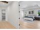 View of the serene main bedroom showcasing an accent rug and decor touches at 2106 S Cortez Ave, Tampa, FL 33629