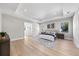 Bright and airy main bedroom with tray ceilings, wood floors, and large windows at 2106 S Cortez Ave, Tampa, FL 33629