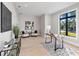 Bright and airy office space featuring a large window and modern furnishings at 2106 S Cortez Ave, Tampa, FL 33629