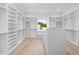 Bright walk-in closet featuring custom shelving and drawers, offering ample storage and organization at 2106 S Cortez Ave, Tampa, FL 33629