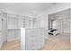 Spacious walk-in closet with custom built-ins and drawers, connecting to the main bedroom at 2106 S Cortez Ave, Tampa, FL 33629
