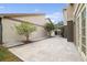 Private backyard patio with gravel landscaping and two small trees at 3554 Deer Run S, Palm Harbor, FL 34684