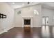 Living area with fireplace, hardwood floors and backyard access at 3554 Deer Run S, Palm Harbor, FL 34684
