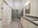 Bathroom featuring a walk-in shower with glass enclosure at 3554 Deer Run S, Palm Harbor, FL 34684