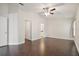 Primary bedroom with hardwood floors and ensuite bathroom access at 3554 Deer Run S, Palm Harbor, FL 34684