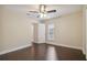 Spacious bedroom with hardwood floors and access to a hallway at 3554 Deer Run S, Palm Harbor, FL 34684