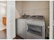 Laundry room with washer, dryer, and shelving at 3554 Deer Run S, Palm Harbor, FL 34684