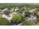 Aerial view of neighborhood showcasing surrounding homes and landscape at 3554 Deer Run S, Palm Harbor, FL 34684