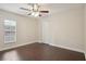 Well lit bedroom featuring hardwood floors and a spacious closet at 3554 Deer Run S, Palm Harbor, FL 34684
