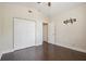 Bedroom with double door closet and hardwood floors at 3554 Deer Run S, Palm Harbor, FL 34684