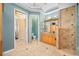 A stunning bathroom features a large vanity, shower, and intricate tile flooring at 1227 Toscano Dr, Trinity, FL 34655