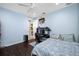 A bedroom features a ceiling fan, a desk, and access to the bathroom at 1227 Toscano Dr, Trinity, FL 34655