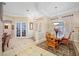 Bright dining room with elegant chandelier, large windows, and detailed molding at 1227 Toscano Dr, Trinity, FL 34655