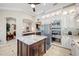 Bright kitchen features an island, granite countertops, and stainless steel appliances at 1227 Toscano Dr, Trinity, FL 34655