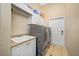 Functional laundry room with modern washer and dryer at 1227 Toscano Dr, Trinity, FL 34655