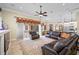 An open living room with a view of the pool area and the kitchen at 1227 Toscano Dr, Trinity, FL 34655