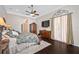 A spacious main bedroom with a ceiling fan and hardwood floors at 1227 Toscano Dr, Trinity, FL 34655
