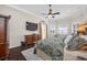 Main bedroom boasts a ceiling fan, hardwood floors, and two windows at 1227 Toscano Dr, Trinity, FL 34655