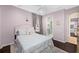 Light and airy bedroom with a queen bed and en suite bath at 1227 Toscano Dr, Trinity, FL 34655