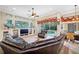 Gathering room with pool view, leather furniture, and built-ins at 1227 Toscano Dr, Trinity, FL 34655