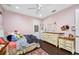 Bright bedroom with twin bed and ample storage at 1227 Toscano Dr, Trinity, FL 34655