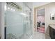 Modern bathroom with a large walk-in shower and pebble floor at 1227 Toscano Dr, Trinity, FL 34655
