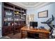 Spacious home office with built-in shelving and a treadmill at 1227 Toscano Dr, Trinity, FL 34655