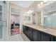 Elegant bathroom with double vanity, granite counters, and a large walk-in shower at 1227 Toscano Dr, Trinity, FL 34655
