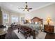Main bedroom with king-size bed and dark wood furniture at 1227 Toscano Dr, Trinity, FL 34655