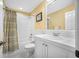 Bright bathroom with white vanity, bathtub, and patterned floor at 1227 Toscano Dr, Trinity, FL 34655