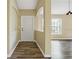 Bright entryway with neutral walls and wood-look floors at 5723 Autumn Shire Dr, Zephyrhills, FL 33541
