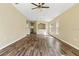 Large living room with wood-look floors and high ceilings at 5723 Autumn Shire Dr, Zephyrhills, FL 33541