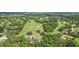 Aerial view of a golf course and surrounding neighborhood at 5723 Autumn Shire Dr, Zephyrhills, FL 33541