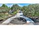 House with circular driveway and fountain, tree-lined lot at 13231 Snowy Plover Ave, Weeki Wachee, FL 34614