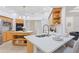 Modern kitchen with island, stainless steel appliances, and light wood cabinets at 13231 Snowy Plover Ave, Weeki Wachee, FL 34614