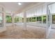 Sunroom with tile floor, ceiling fan, and screened windows at 13231 Snowy Plover Ave, Weeki Wachee, FL 34614