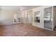Sunroom with tile floor, ceiling fan, and access to backyard at 13231 Snowy Plover Ave, Weeki Wachee, FL 34614