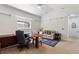 Home office with a large desk, comfortable seating, and plenty of natural light at 13231 Snowy Plover Ave, Weeki Wachee, FL 34614