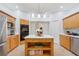 Updated kitchen features island, double oven, and ample counter space at 13231 Snowy Plover Ave, Weeki Wachee, FL 34614