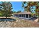 Home with screened porch and large backyard at 13231 Snowy Plover Ave, Weeki Wachee, FL 34614