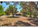 House surrounded by lush trees, spacious backyard at 13231 Snowy Plover Ave, Weeki Wachee, FL 34614